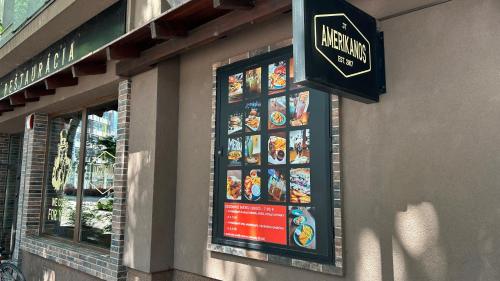 a restaurant sign on the side of a building at MILET style and spacy 2 room apartment with AC in Bratislava Nivy in Nivy