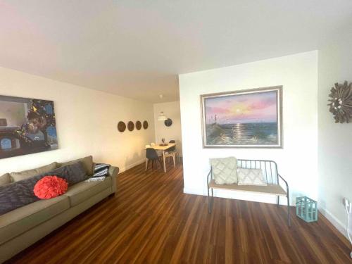 a living room with a couch and a table at 2 Bedroom Apartment Free Reserved Parking in Miami