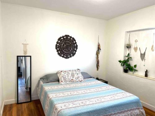 a bedroom with a bed and a mirror at 2 Bedroom Apartment Free Reserved Parking in Miami