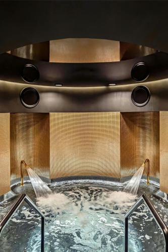 a bath tub with two water jets in it at W Prague in Prague