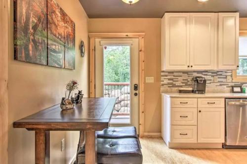 a kitchen with a wooden table in a room at Heaven in the Smokies 3 by Avada Properties in Gatlinburg