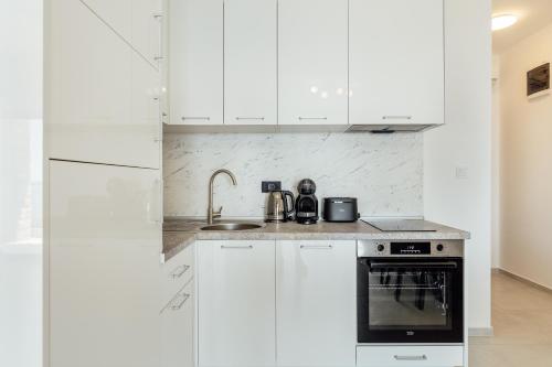 Kuchyň nebo kuchyňský kout v ubytování Veslo Sea Blue Apartments - Lustica