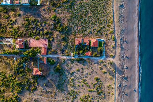 an overhead view of houses on the shore of the water at Thea Apartment near the Agkali - Ayia Anna beach in Evia in Kría Vrísi