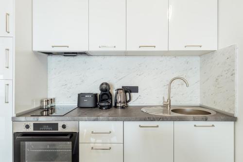 Kuchyň nebo kuchyňský kout v ubytování Veslo Sea Blue Apartments - Lustica