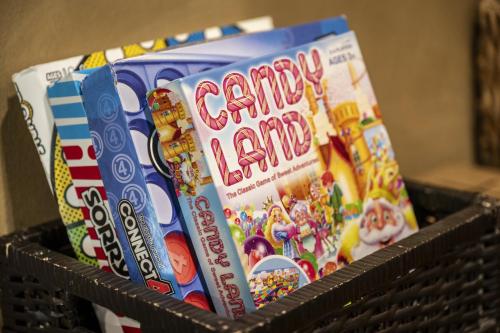 a basket full of candy land books at Smoky Mtns Private w/Hot Tub, Game Room, Pets Free in Sevierville