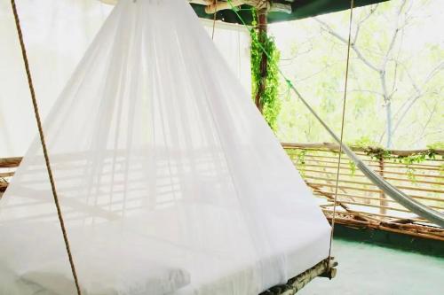 Casa con alberca y acceso directo a la playaにあるベッド