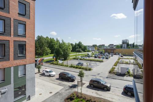 a view of a parking lot from a building at Convenient Apartment for 5 with Sauna in Kirkkonummi