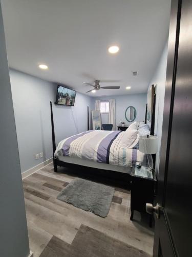 a bedroom with a bed in a room at Charlies by the Bay Unit 1 in New Baltimore