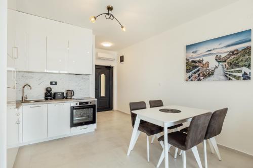 Kuchyň nebo kuchyňský kout v ubytování Veslo Sea Blue Apartments - Lustica