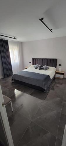 a bedroom with a large bed and a chair at Sol Del Mar in Benicarló