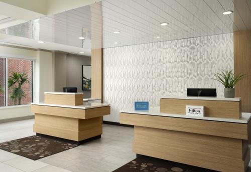 an office lobby with a reception desk at Hilton Garden Inn Tampa East Brandon in Tampa
