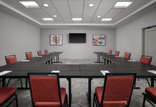 a conference room with a long table and chairs at Hilton Garden Inn Tampa East Brandon in Tampa