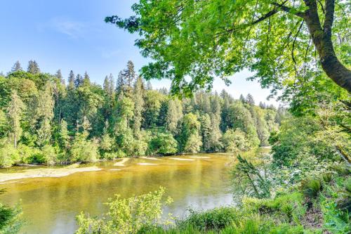 a river in the middle of a forest at Riverfront Woodland Cabin Wooded and Forested Views in Woodland