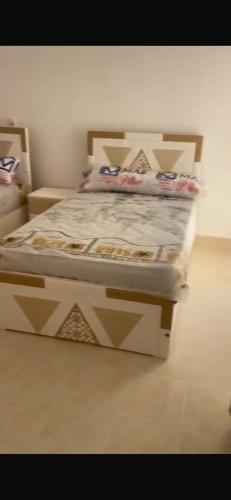 a bed in a room with a bed frame at Villaggio lavie in Ras Sedr