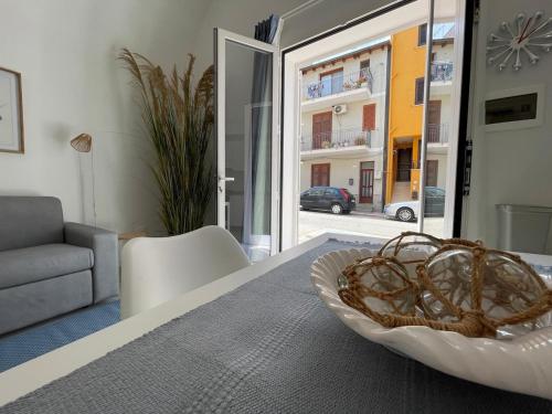 a room with a table with a bowl on it at Anfrasipe apartment in Terrasini