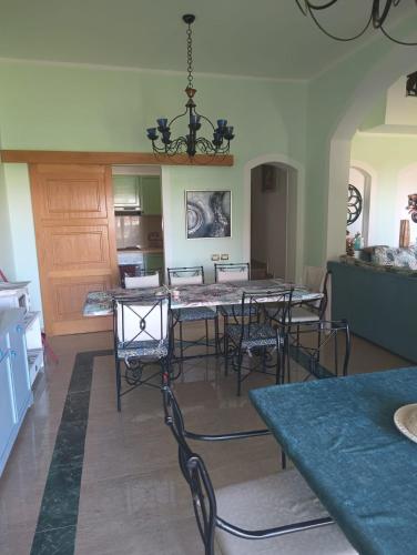 a dining room with a table and chairs at Domina Coral Bay Resort in Sharm El Sheikh