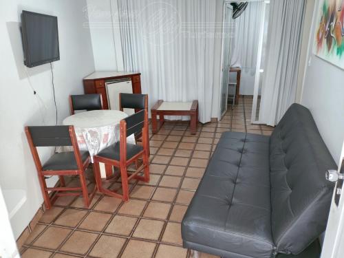 a living room with a couch and a table at Condomínio CTC Araras, Caldas Novas - VPC in Caldas Novas