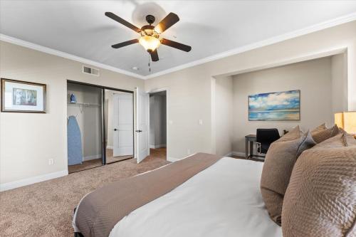 a bedroom with a bed and a ceiling fan at New Stylish 1BR Apt with Heated Pool Gym & Yoga Studio in Reno
