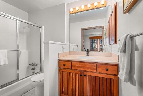 a bathroom with a sink and a shower and a toilet at Woodbridge Condo by Snowmass Vacations in Snowmass Village
