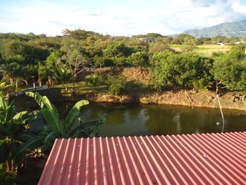 a view of a river from a house at Finca Hotel Villa el Ocaso Huila in Rivera