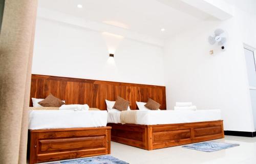Postel nebo postele na pokoji v ubytování Liyon Hotel