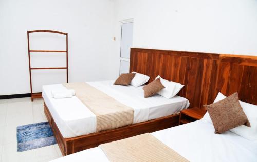 Cama o camas de una habitación en Liyon Hotel