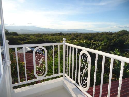 a balcony with a view of the mountains at Finca Hotel Villa el Ocaso Huila in Rivera