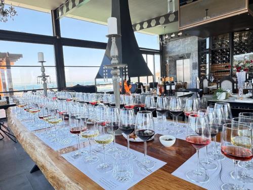 a row of wine glasses sitting on a bar at Ferush Boutique Hotel in Urla