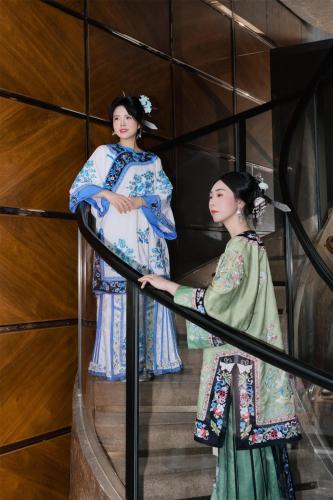 two geisha standing on the stairs of a building at Kempinski Hotel Fuzhou in Fuzhou
