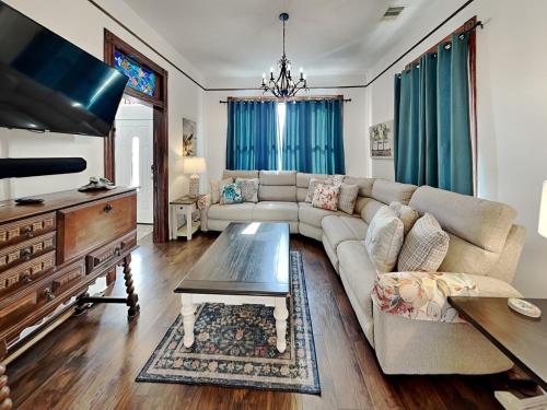 a living room with a couch and a table at The Vintage Sea Turtle in Galveston