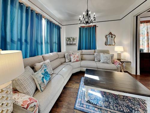 a living room with a couch and a table at The Vintage Sea Turtle in Galveston
