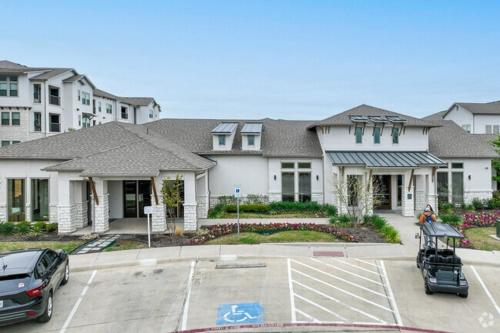 a group of houses with cars parked in a parking lot at Chisholm Trace 734 I Spacious 1 Bed 1 Bath in Cleburne