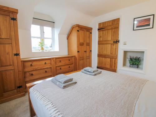 Postel nebo postele na pokoji v ubytování Clandyke Cottage