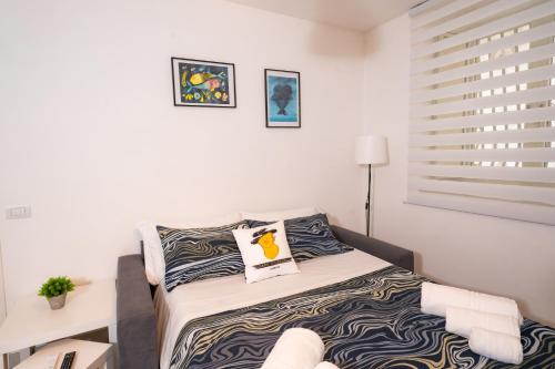 Ένα ή περισσότερα κρεβάτια σε δωμάτιο στο Casa Cicerone Lucrino