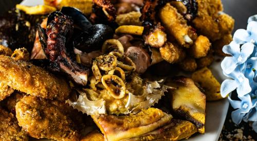 a pile of fried food on a plate at Hotel San Juan Internacional in Bucaramanga