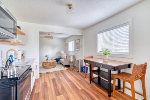 a kitchen and living room with a table and chairs at Stay Portland - Amazing Giant Studio in Brooklyn in Portland