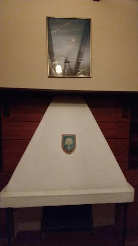 a white bench in a room with a picture on the wall at Mansión de la Bolivia in La Paz