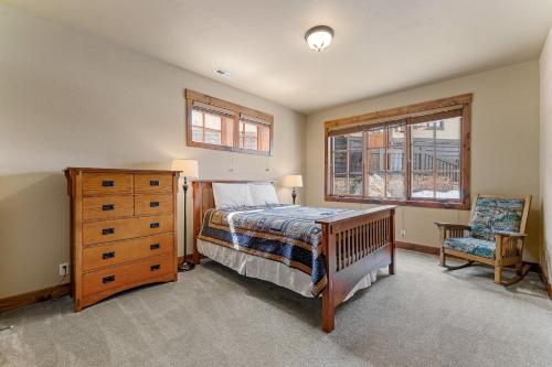 a bedroom with a bed and a dresser and a chair at Lady Luck by the Beach - Downtown Greystone unit with air conditioning in McCall
