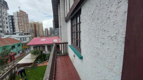 a balcony of a building with a view of a city at Mansión de la Bolivia in La Paz