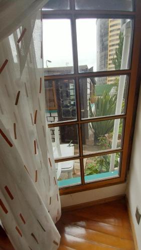 a room with a large window with a view at Mansión de la Bolivia in La Paz