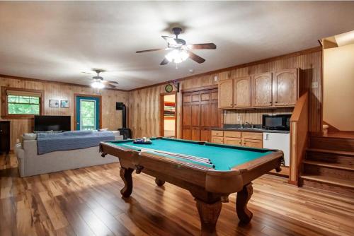 a living room with a pool table in it at Black Bear Lookout by Avada Properties in Townsend