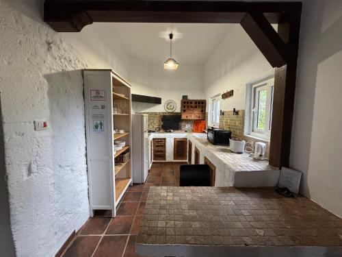 a kitchen with a white refrigerator and a counter at CASA RURAL con BONITAS VISTAS in Teror