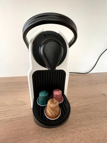 a coffee maker with food inside of it on a table at Menhirs et Moutons Ouessant in Plouëc-du-Trieux
