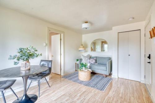 a living room with a table and a couch at Stay Portland - Adorable Bright 1 Bed Near OHSU in Portland