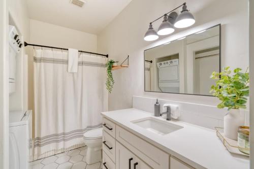 a white bathroom with a sink and a mirror at Stay Portland - Perfect Portland Farmhouse Loft - Breweries & Bars in Portland