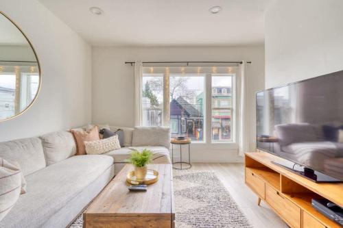 a living room with a couch and a large tv at Stay Portland - Perfect Portland Farmhouse Loft - Breweries & Bars in Portland