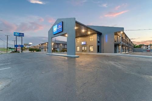 an empty parking lot in front of a building at Baymont by Wyndham San Antonio Near Lackland AFB in San Antonio