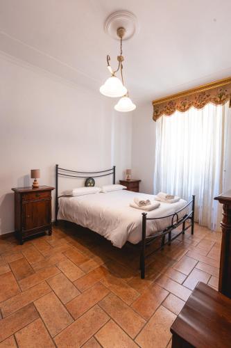 Кровать или кровати в номере Palazzetto San Lorenzo