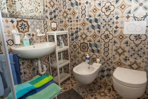 a bathroom with a sink and a toilet at BB Piedarienzo in San Felice a Cancello