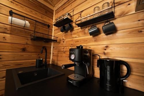 a kitchen with a coffee maker on a counter at Stacja Natura in Radom